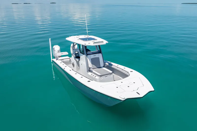 Slide: The Image of 2022 Costa Custom Boats 264 on calm turquoise water, showcasing sleek design and modern features. - 18