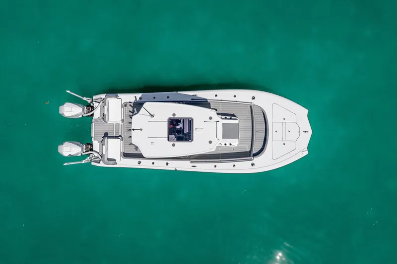 Slide: The Image of Aerial view of 2022 Costa Custom Boats 264 on turquoise water. - 19