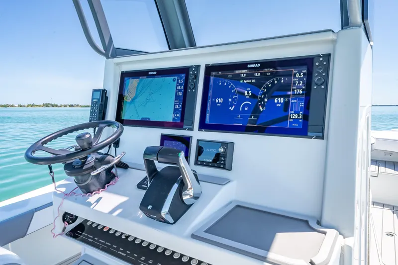 Slide: The Image of 2022 Costa Custom Boats 264 dashboard with advanced navigation and control systems. - 26