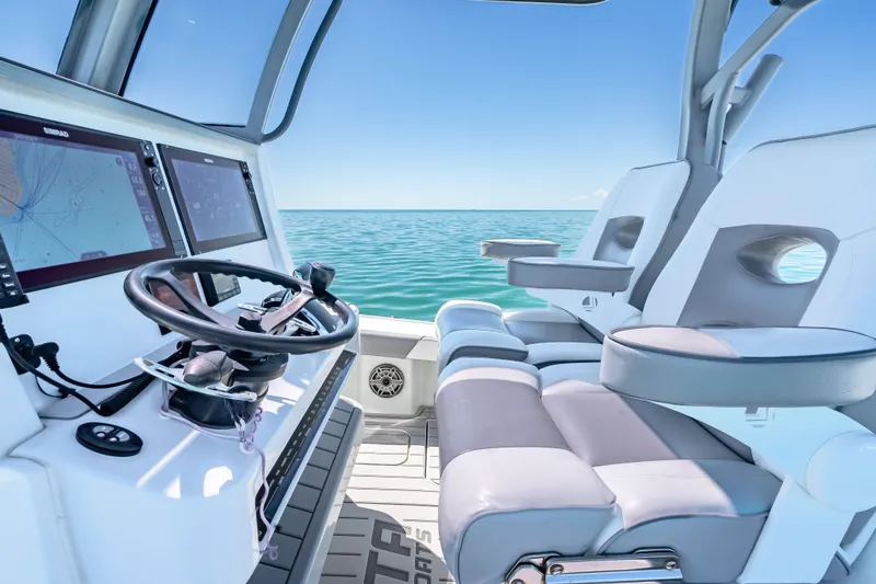 Slide: The Image of 2022 Costa Custom Boats 264 helm with dual screens and ocean view. - 28