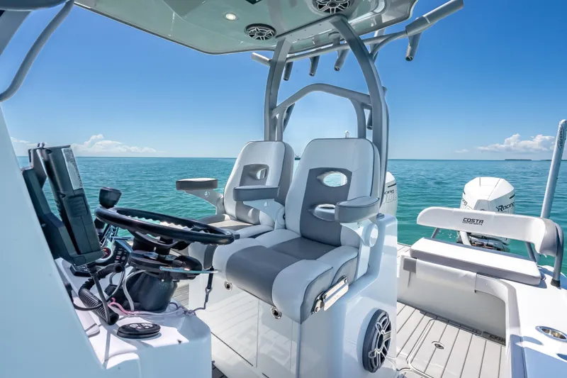 Slide: The Image of 2022 Costa Custom Boats 264 interior with dual seats and ocean view. - 29