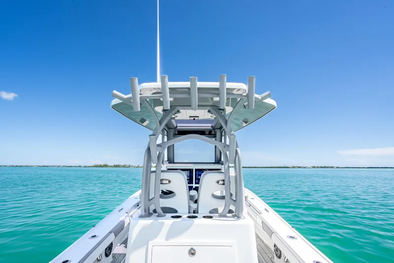 Slide: The Image of 2022 Costa Custom Boats 264 on clear blue water under a bright sky. - 41