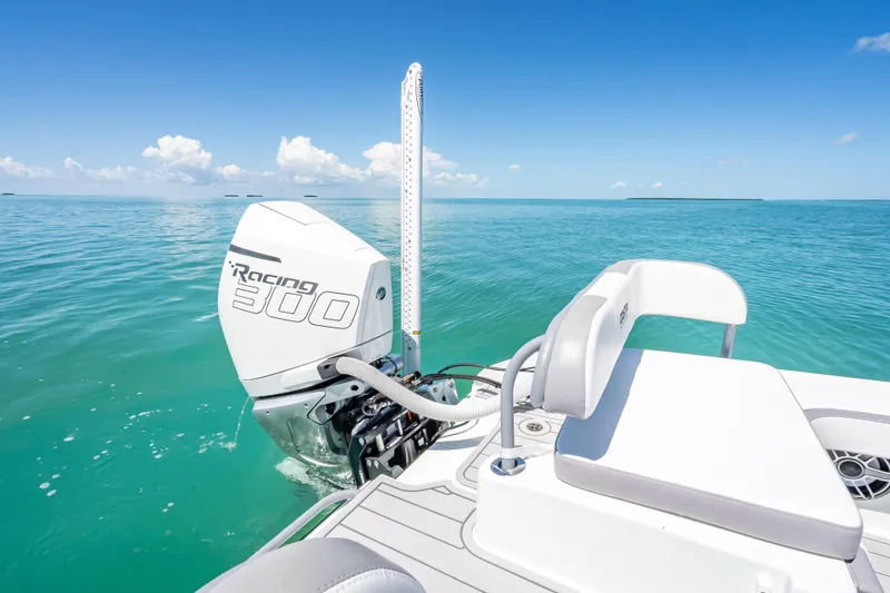 Slide: The Image of 2022 Costa Custom Boats 264 with Racing 300 engine on clear blue water. - 48