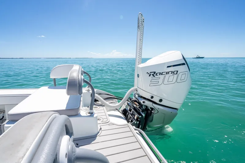 Slide: The Image of 2022 Costa Custom Boats 264 with Racing 300 engine on clear blue water. - 49