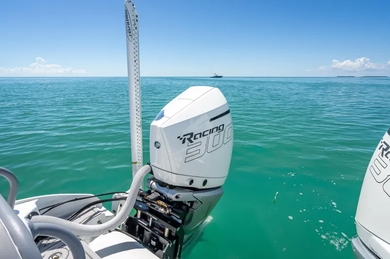 Slide: The Image of Costa Custom Boats 264, 2022 model, with powerful outboard motor on turquoise sea. - 50