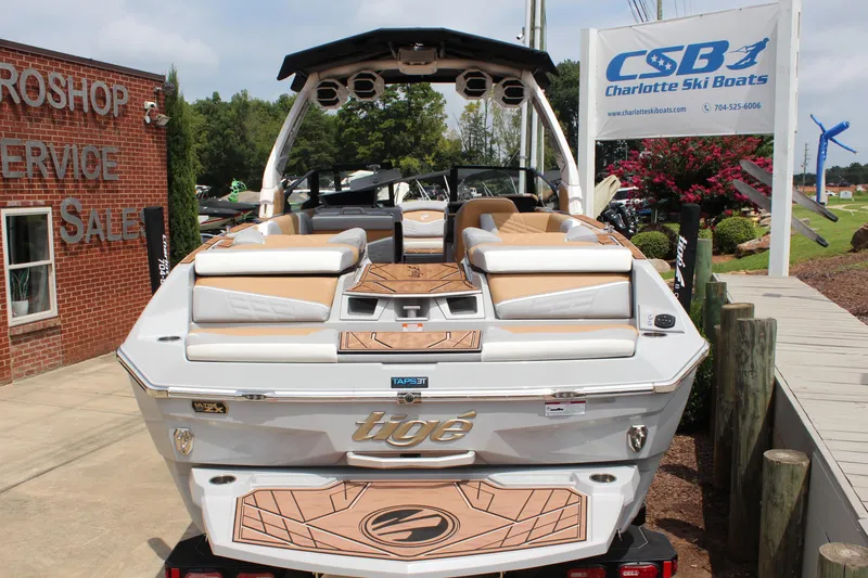 Slide: The Image of 2024 Tigé Ultré 25ZX boat at Charlotte Ski Boats dealership, showcasing luxury design. - 14