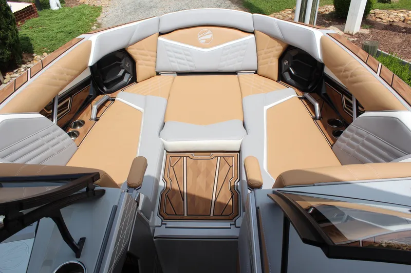 Slide: The Image of Luxurious interior of 2024 Tigé Ultré 25ZX boat with tan and gray seating. - 9