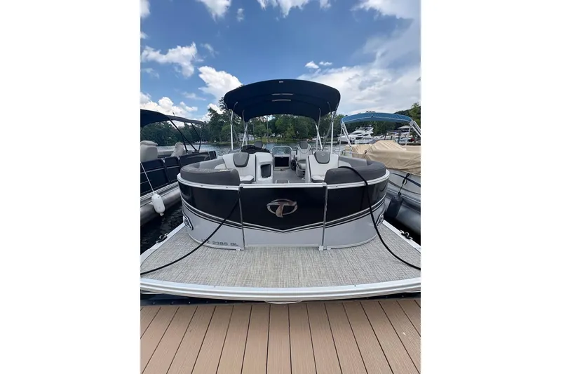 Slide: The Image of 2023 Tahoe Pontoon Sport LTZ Quad Lounger docked under a blue sky. - 10