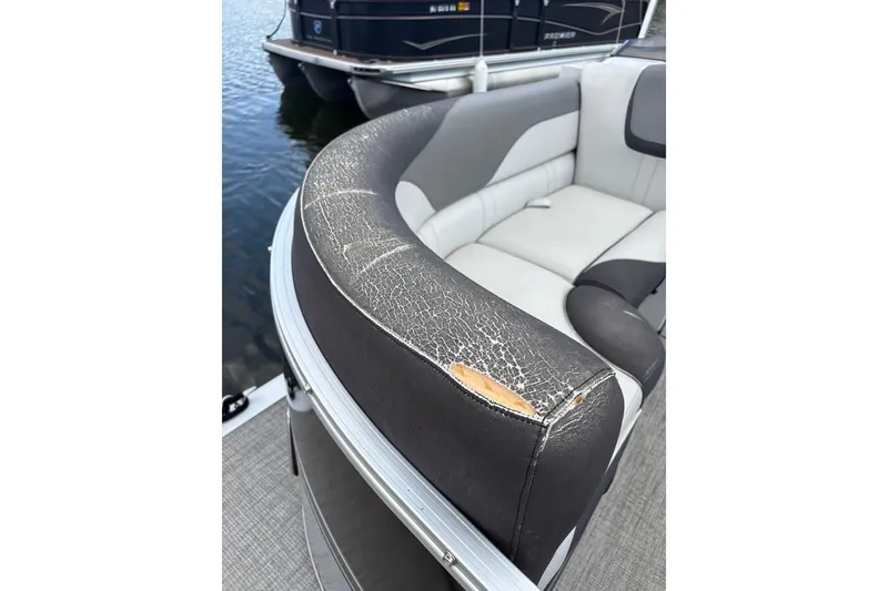 Slide: The Image of 2023 Tahoe Pontoon Sport LTZ Quad Lounger with worn upholstery detail. - 9