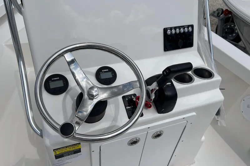 Slide: The Image of Steering console of 2026 May-Craft 192 boat with Yamaha controls and gauges. - 12