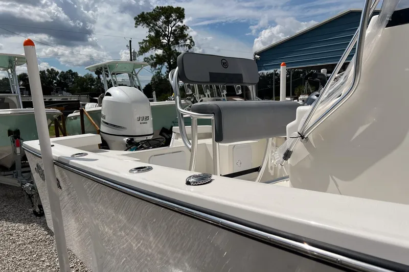 Slide: The Image of 2026 May-Craft 192 boat with Yamaha engine, parked outdoors under a cloudy sky. - 16