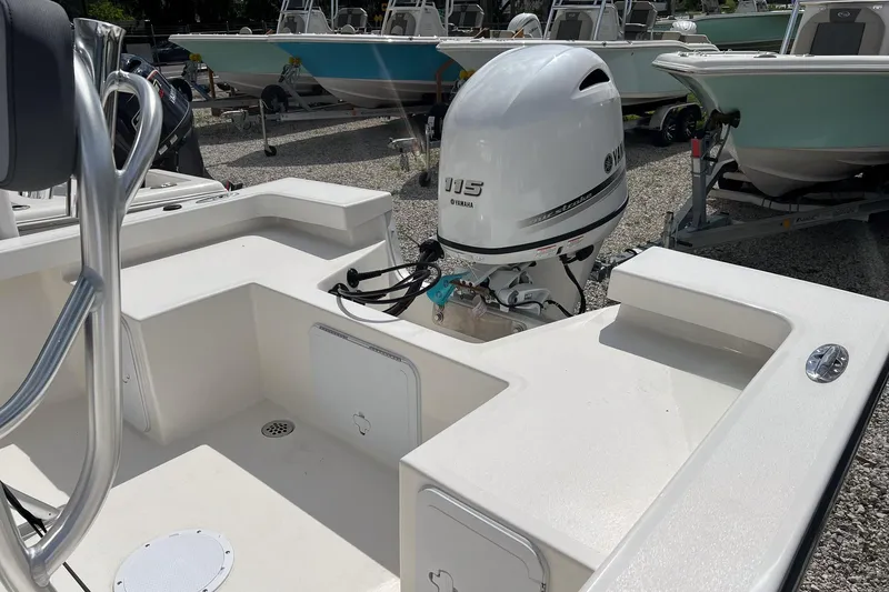 Slide: The Image of 2026 May-Craft 192 boat with Yamaha 115 outboard motor, displayed in a boatyard. - 7