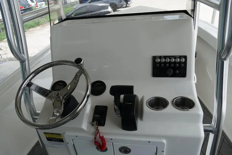 Slide: The Image of Control panel of 2026 Defiance CATALINA 192 boat with steering wheel and controls. - 10
