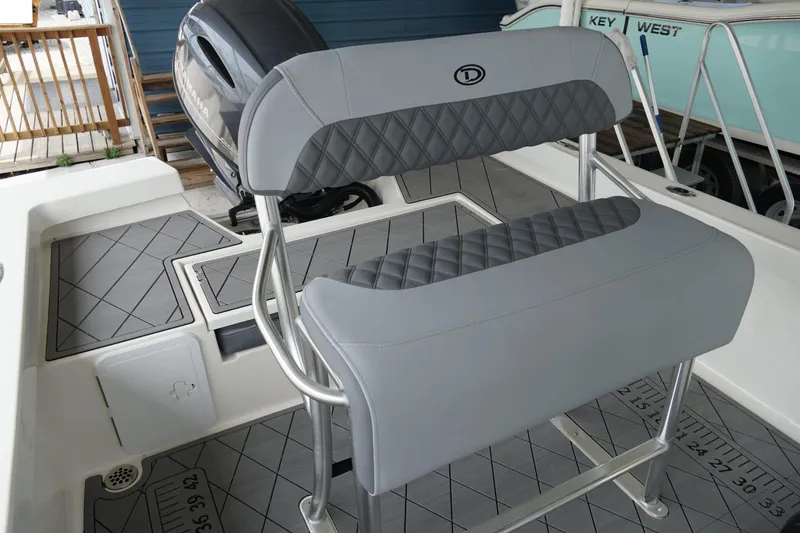 Slide: The Image of Defiance CATALINA 192 boat interior, featuring cushioned seating and modern design, 2026 model. - 13