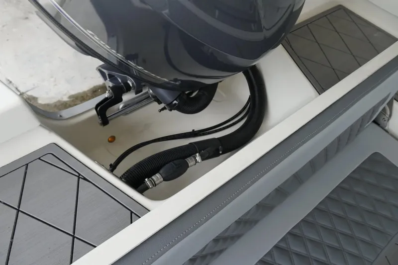 Slide: The Image of 2026 Defiance CATALINA 192 boat engine compartment with detailed wiring and seating. - 17