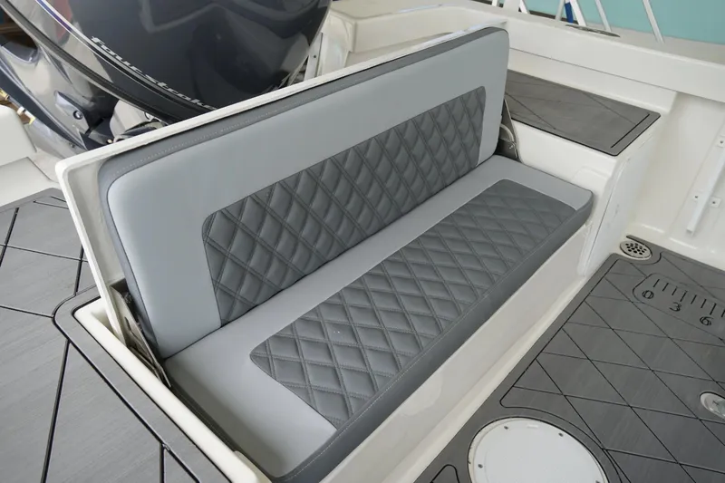 Slide: The Image of Luxury seating on 2026 Defiance CATALINA 192 boat with quilted gray upholstery. - 18