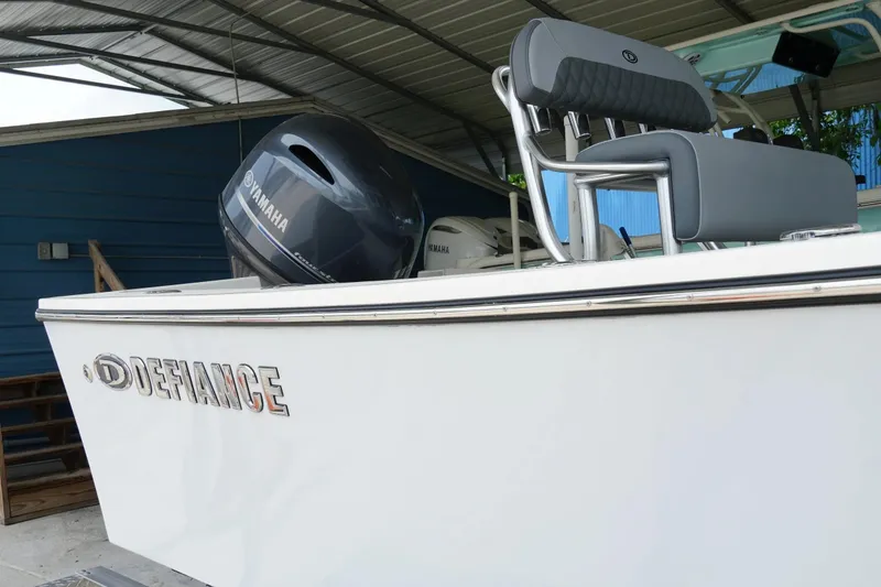 Slide: The Image of 2026 Defiance CATALINA 192 boat with Yamaha engine, under a metal canopy. - 6