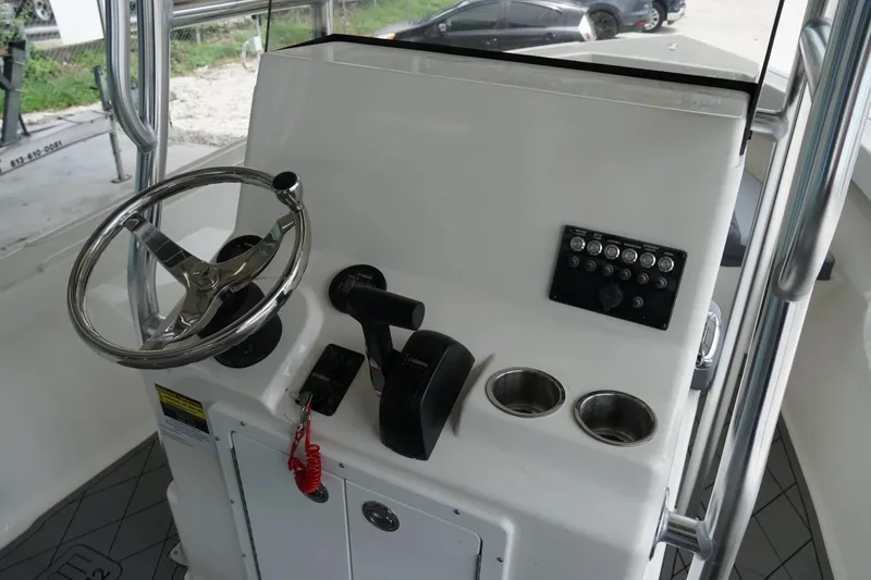 Slide: The Image of Defiance CATALINA 192 boat console, 2026 model, featuring steering wheel and control panel. - 9