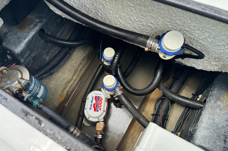 Slide: The Image of Bilge area of 2020 Yellowfin 24 Bay CE boat with pumps and hoses. - 26