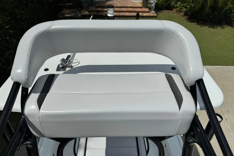 Slide: The Image of 2020 Yellowfin 24 Bay CE boat seat with sleek white upholstery and black accents. - 31