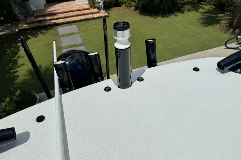 Slide: The Image of 2020 Yellowfin 24 Bay CE boat deck with rod holders and antenna, viewed from above. - 32