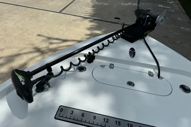 Slide: The Image of 2020 Yellowfin 24 Bay CE boat with trolling motor and measurement scale. - 33