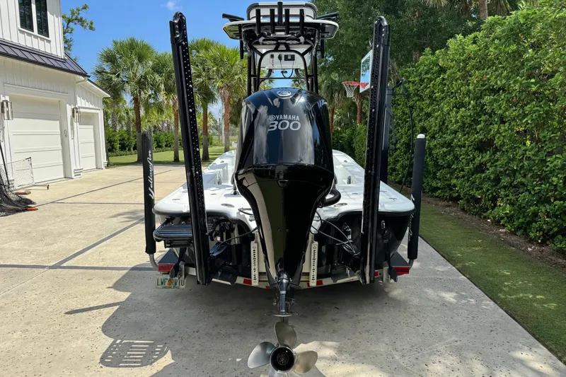 Slide: The Image of 2020 Yellowfin 24 Bay CE boat with Yamaha 300 engine, parked in driveway. - 4