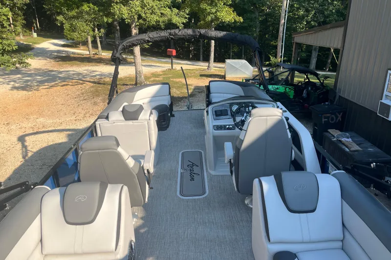 Slide: The Image of 2023 Avalon LSZ 2585 QL pontoon boat with spacious seating and modern design. - 10