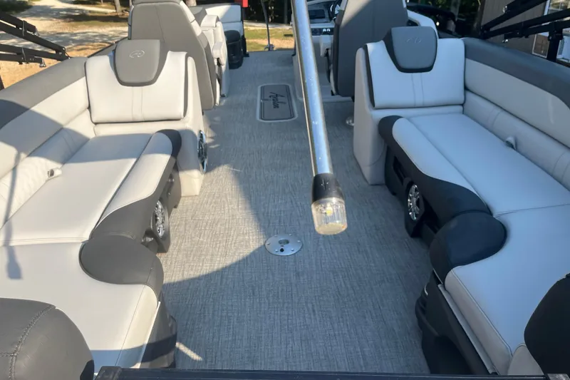 Slide: The Image of 2023 Avalon LSZ 2585 QL pontoon boat interior with luxurious seating and modern design. - 11