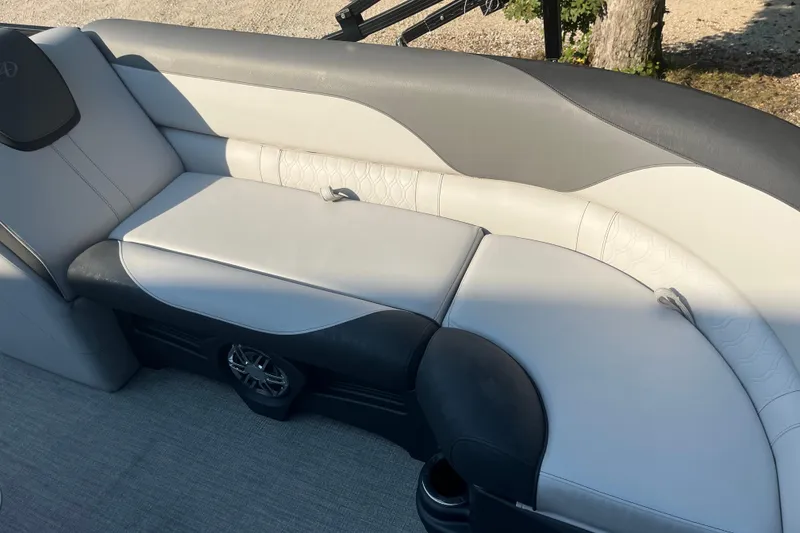 Slide: The Image of 2023 Avalon LSZ 2585 QL boat interior with stylish gray seating and speaker. - 5