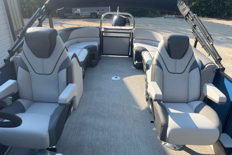 Slide: The Image of 2023 Avalon LSZ 2585 QL pontoon boat interior with luxurious seating and modern design. - 7