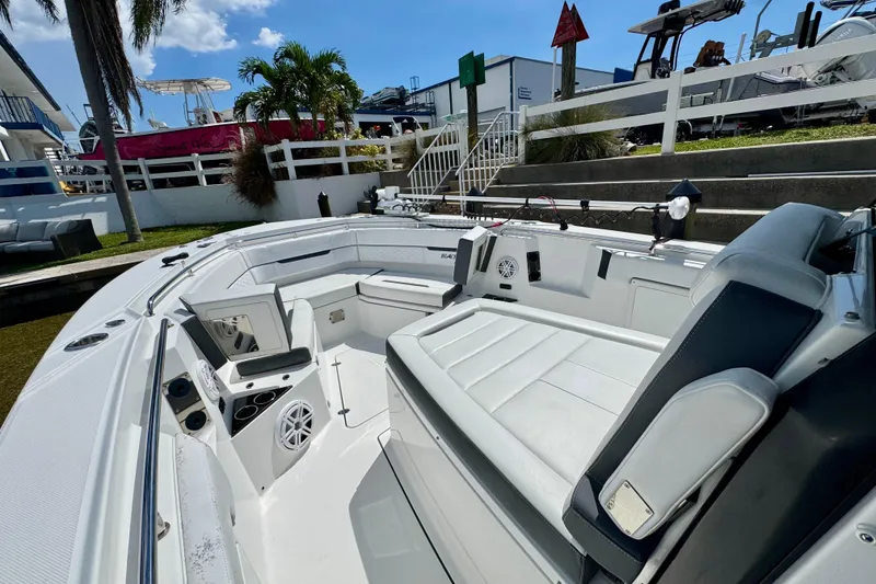 Slide: The Image of 2021 Blackfin 332 CC boat interior with seating and fishing rod holders. - 35
