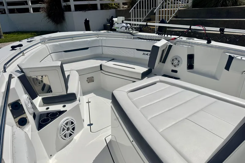 Slide: The Image of 2021 Blackfin 332 CC boat interior with white seating and modern design. - 36