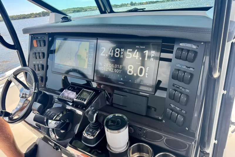 Slide: The Image of Dashboard of 2021 Blackfin 332 CC boat with navigation and control systems. - 40