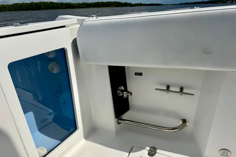 Slide: The Image of 2021 Blackfin 332 CC boat interior with stainless steel fixtures and storage compartment. - 45