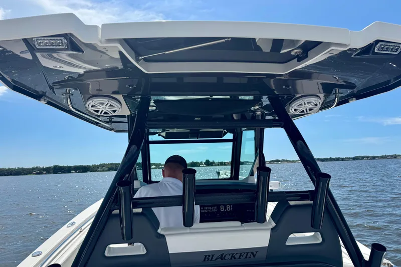Slide: The Image of 2021 Blackfin 332 CC boat on water, featuring sleek design and modern amenities. - 51