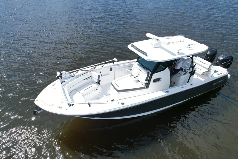 Slide: The Image of 2021 Blackfin 332 CC boat on calm water, featuring sleek design and modern amenities. - 6