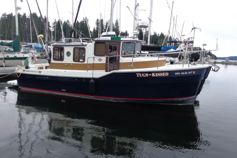The Image of 2011 Ranger Tugs R-29 Classic boat docked with trailer, rear view. - 0