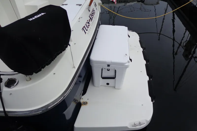 Slide: The Image of 2011 Ranger Tugs R-29 Classic boat stern with cooler on swim platform. - 11