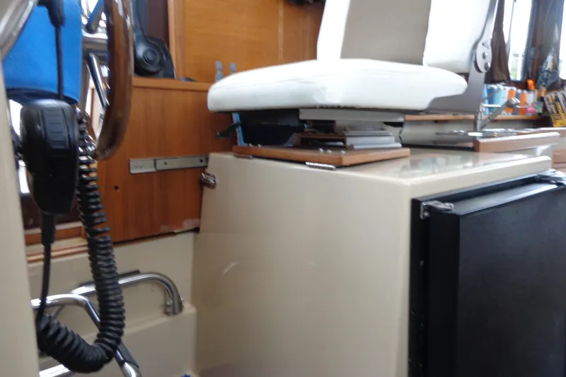 Slide: The Image of 2011 Ranger Tugs R-29 Classic interior helm with seat and radio equipment. - 39