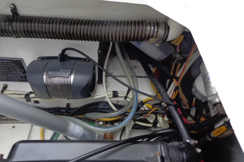 Slide: The Image of 2011 Ranger Tugs R-29 Classic engine compartment with wiring and components. - 51