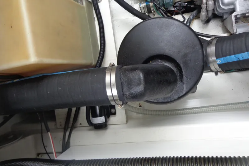 Slide: The Image of Engine compartment of 2011 Ranger Tugs R-29 Classic, showing hoses and components. - 52