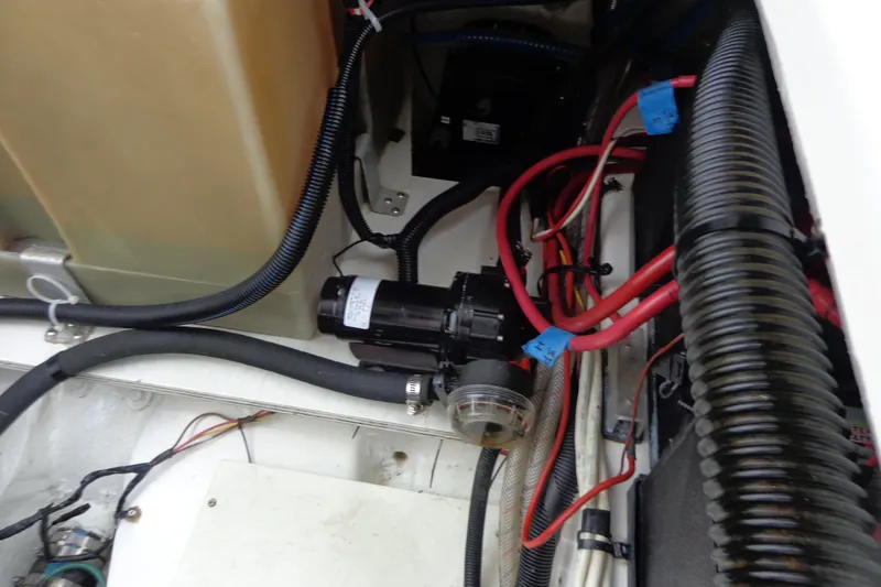 Slide: The Image of Engine compartment of 2011 Ranger Tugs R-29 Classic, showcasing wiring and components. - 54