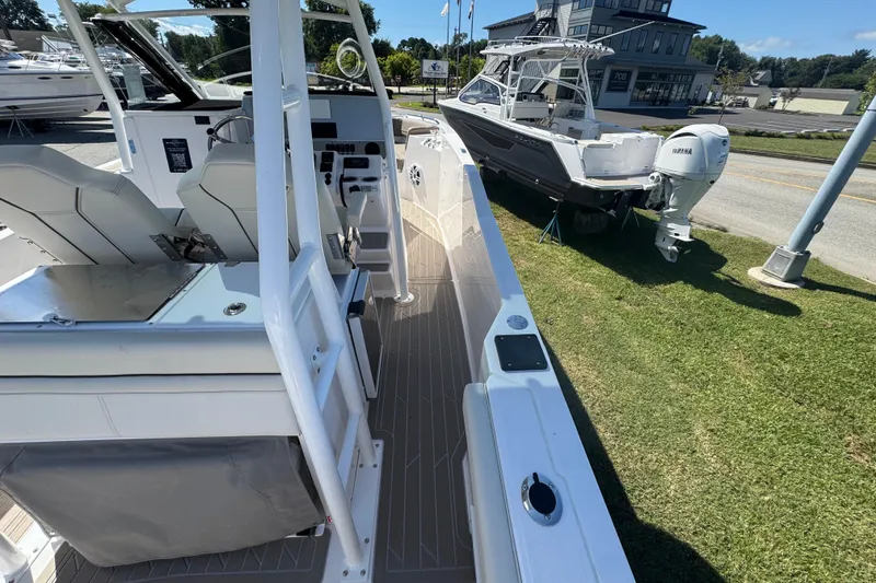 Slide: The Image of 2026 Solara S-250 CW boat interior with seating and control panel, displayed outdoors. - 11