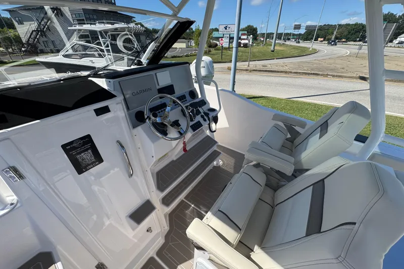 Slide: The Image of Interior view of 2026 Solara S-250 CW boat cockpit with modern controls and seating. - 13