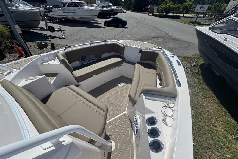 Slide: The Image of 2026 Solara S-250 CW boat interior with beige seating and modern design. - 16