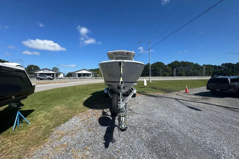 Slide: The Image of Front view of 2026 Solara S-250 CW boat on trailer under clear blue sky. - 3