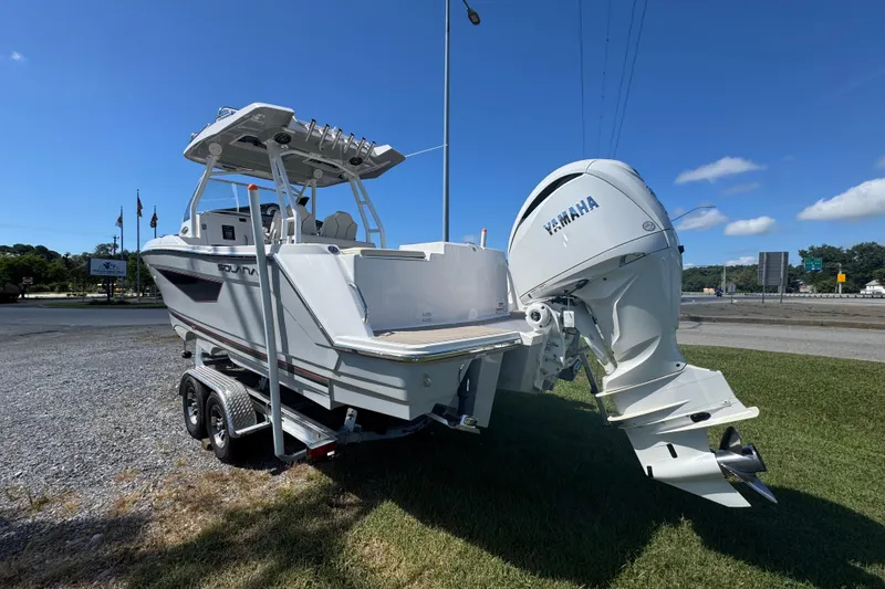 Slide: The Image of 2026 Solara S-250 CW boat with Yamaha engine on trailer, parked outdoors. - 4