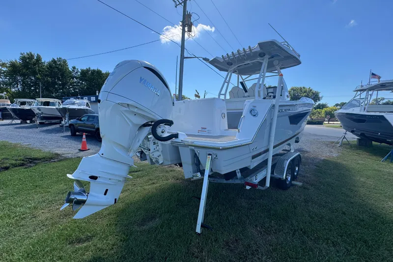 Slide: The Image of 2026 Solara S-250 CW boat with Yamaha outboard motor on trailer, parked outdoors. - 5