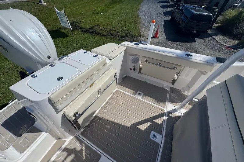 Slide: The Image of 2026 Solara S-250 CW boat deck with seating and storage compartments. - 9